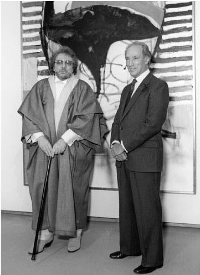 1984 media photograph capturing Canadian abstract painter William Ronald standing alongside then-Prime Minister Pierre Elliott Trudeau in front of Ronald's vibrant, non-representational portrait of the politician
