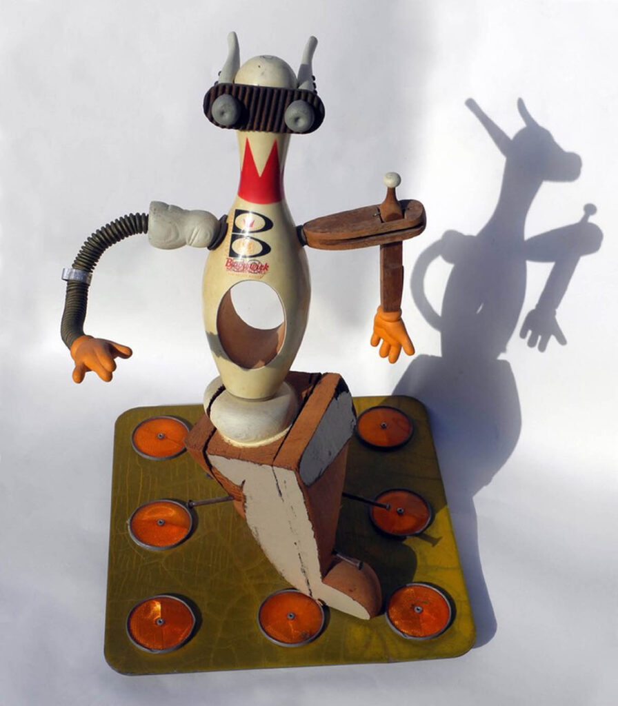 D. Dominick Lombardi, Il Pagliaccio, 1990, carved found wood and bowling pin, found traffic sign, metal, 28 x 18 x 18 inches